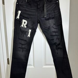 AMIRI Black Distressed Skinny Jeans